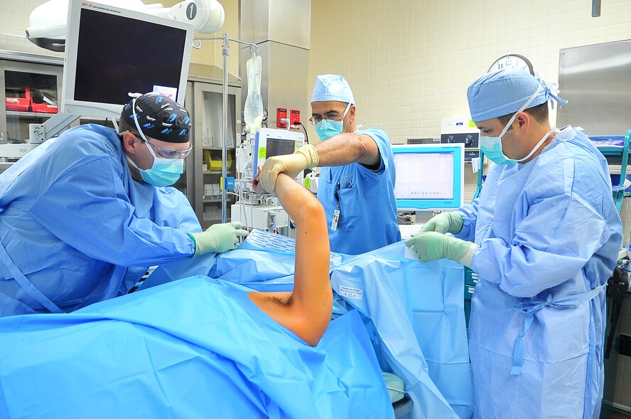 Surgical staff prepare a patient for surgery to repair a torn labrum here June 07, 2012. The labrum is a type of cartilage that makes the shoulder joint more stable and allows the shoulder to have free range of motion. (U.S. Air Force photo/Senior Airman Adam Grant) 