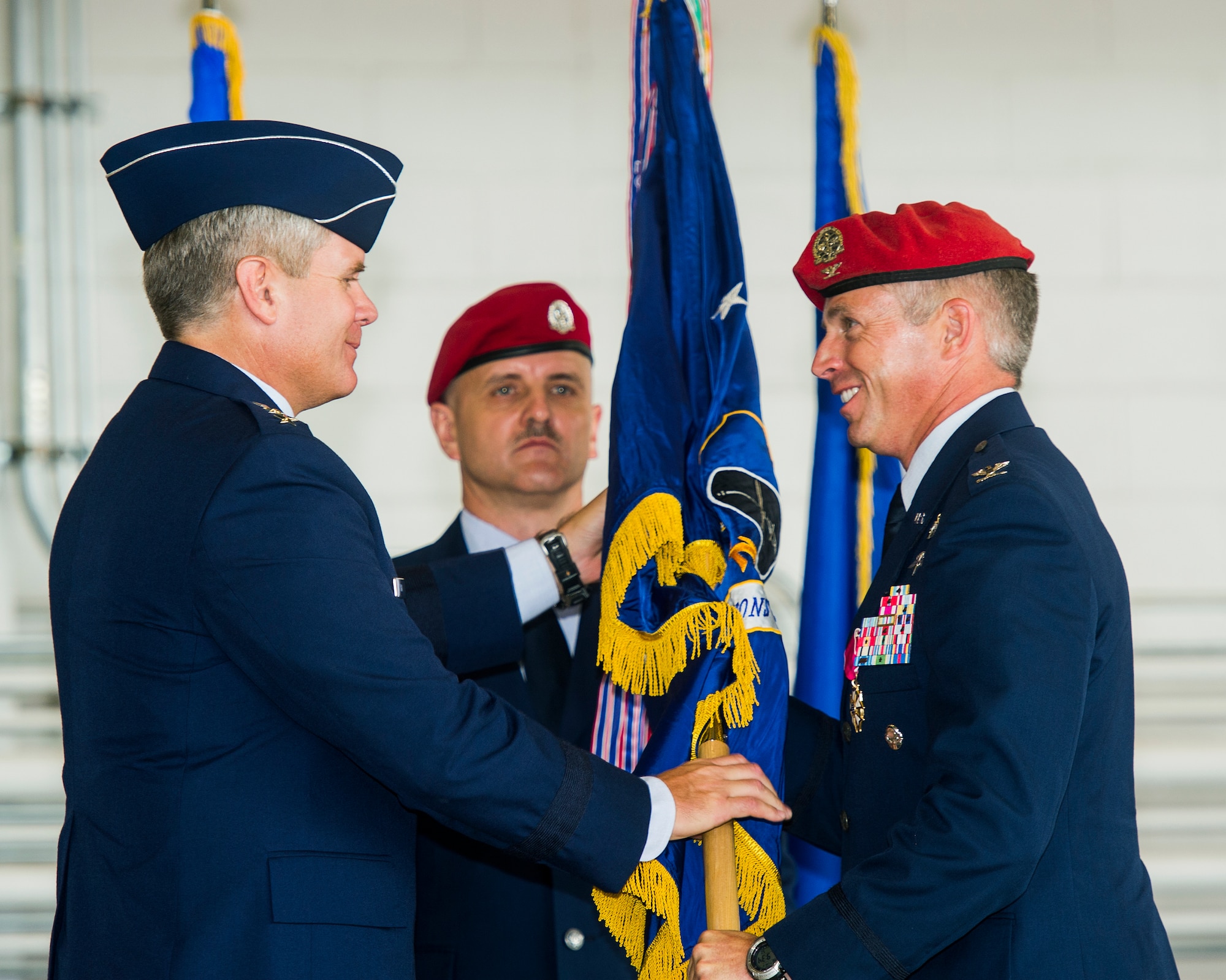 U.S. Air Force Lt. Gen. Eric Fiel, commander of the Air Force Special Operations Command, passes the first guidon from Col. Robert Armfield, commander of 24th Special Operations Wing, at the Freedom Hangar on Hurlburt Field, Fla., June 12, 2012. The 24th SOW will provide special operations battlefield airmen for rapid global employment to enable airpower success. (U.S. Air Force photo/Airman 1st Class Christopher Williams)(Released)
