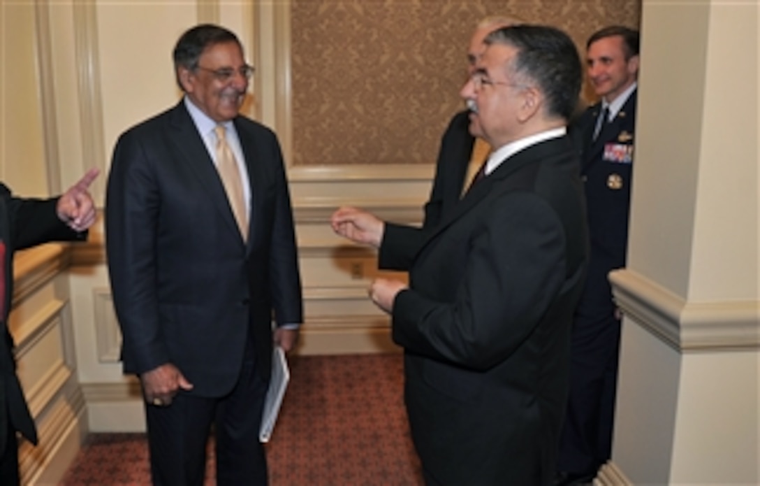 Secretary of Defense Leon E. Panetta listens to Turkish Minister of National Defense Ismet Yilmaz as he arrives to attend the 31st American Turkish Council Conference Dinner in Washington, D.C., on June 11, 2012.  