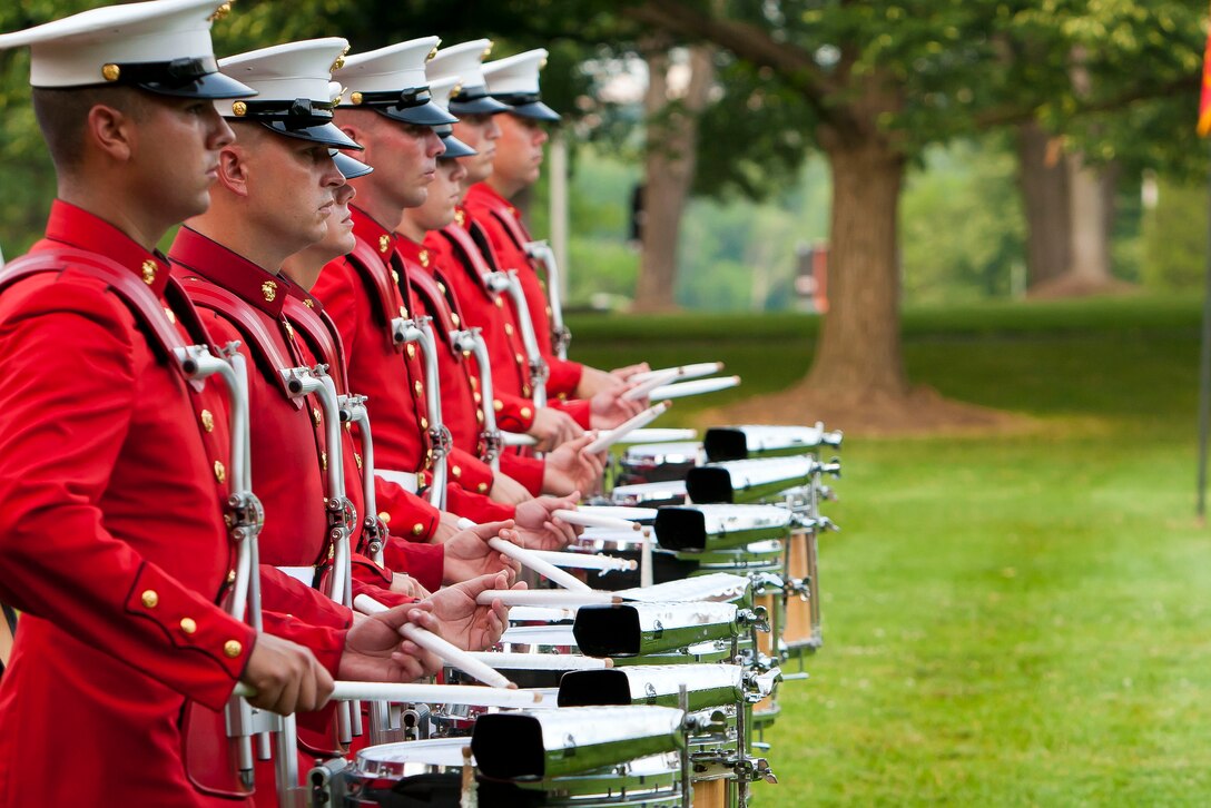 U.S. Marine Drum & Bugle Corps percussion line performs during a Tuesday Sunset Parade at the Marine Corps War Memorial in Arlington, Va., June 12.