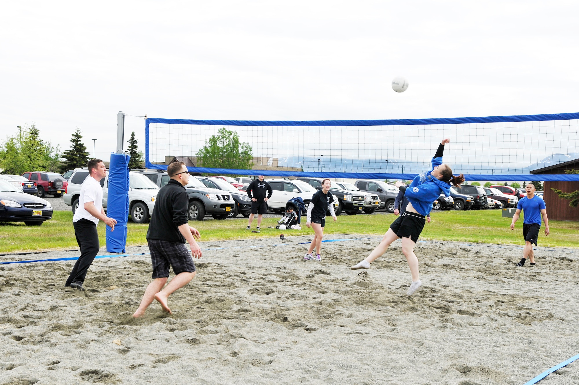 JOINT BASE ELMENDORF-RICHARDSON,Alaska- Players for 703 AMXS vs 673Medical Squadron during the 3-on-3 volleyball tournament,during the annual 2012 JBER Military Appreciation Day and Arctic Warrior Olympics,  the  Anchorage Chamber of Commerce provided a lunch for all base personnel, It was held at both the Paxton Field and Buckner Fitness Center June 8, 2012.  (USAF Photo by Steven White/JBER/PA)