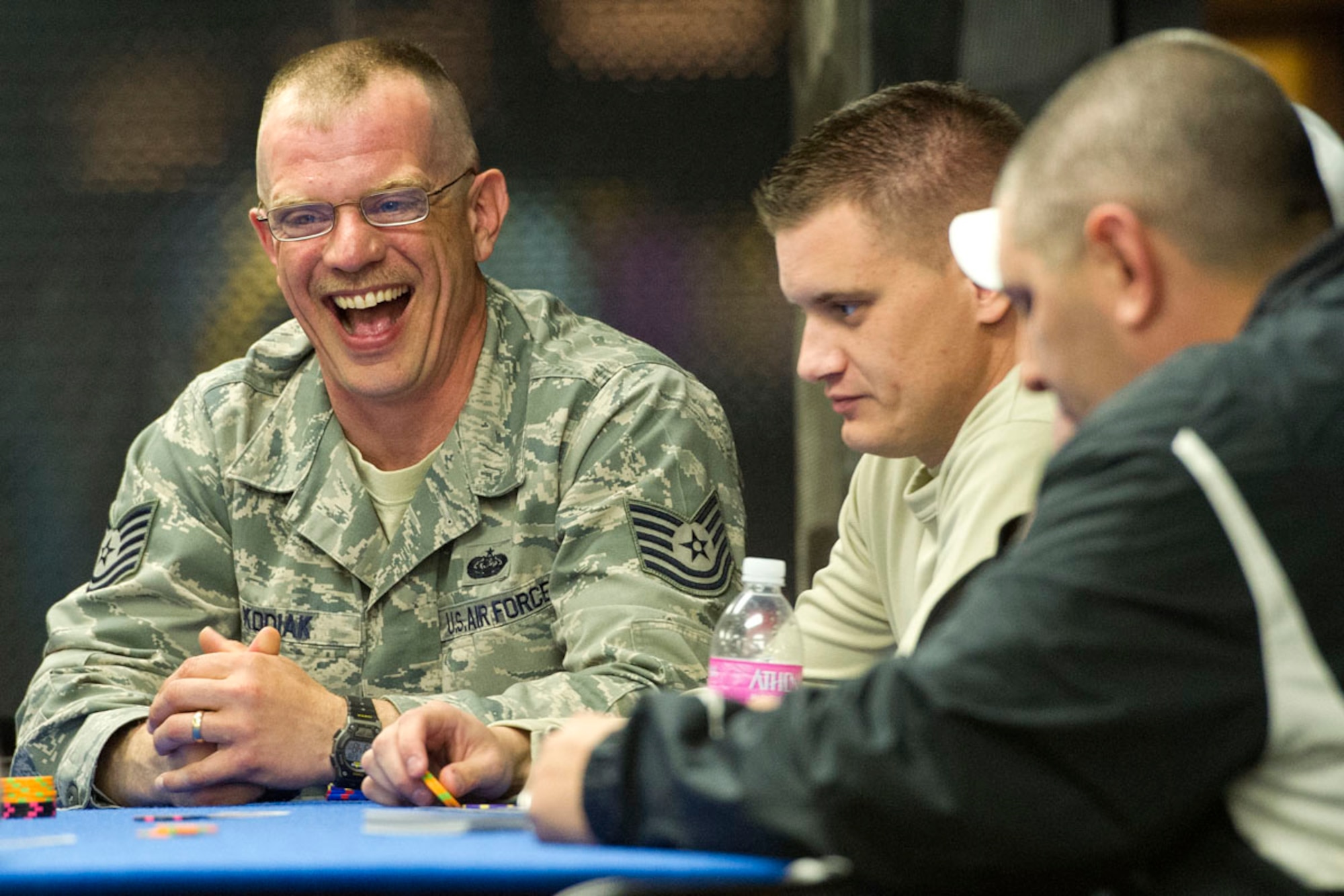 JOINT BASE ELMENDORF-RICHARDSON, Alaska -- Paul Kodiak, 673d Communications Squadron, of Philadelphia, Penn., laughs while playing in theTexas Hold 'Em Tourney at the Arctic Chill during the Military Appreciation Day at Joint Base Elmendorf-Richardson, Friday, June 8, 2012.  (U.S. Air Force/Justin Connaher)