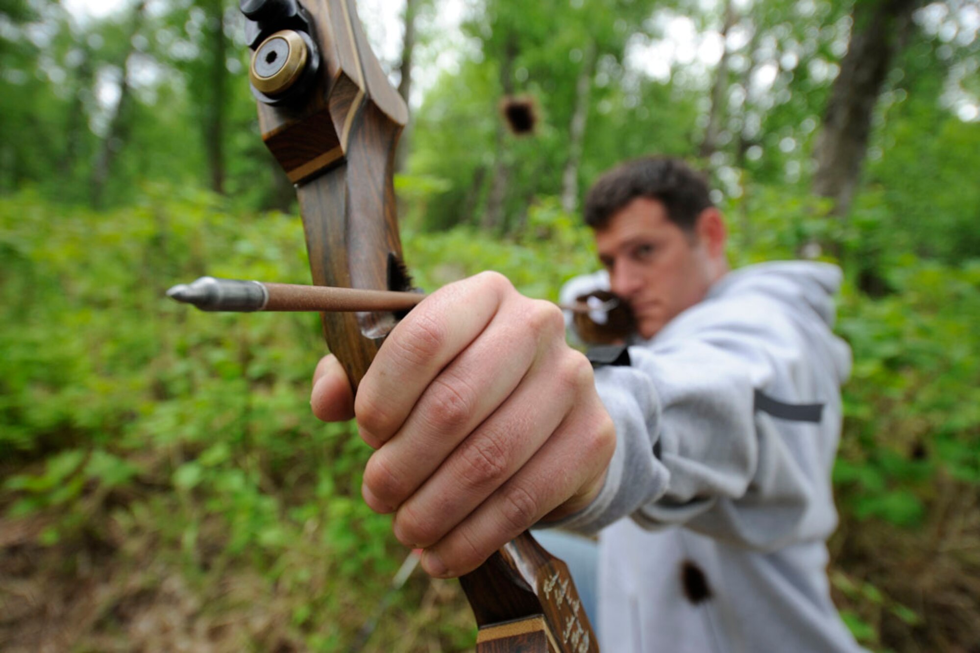 JOINT BASE ELMENDORF-RICHARDSON, Alaska -- 1st Lt. Matthew Rogero steadies a bow and arrow during a round of 3-dimensional archery during the 2012 Arctic Warrior Olympics June 8. The 381st IS took the 2nd place this year in the olympic games. Rogero is the mission support flight commander with the 381st Intelligence Squadron. (U.S. Air Force photo by Staff Sgt. Cynthia Spalding)
