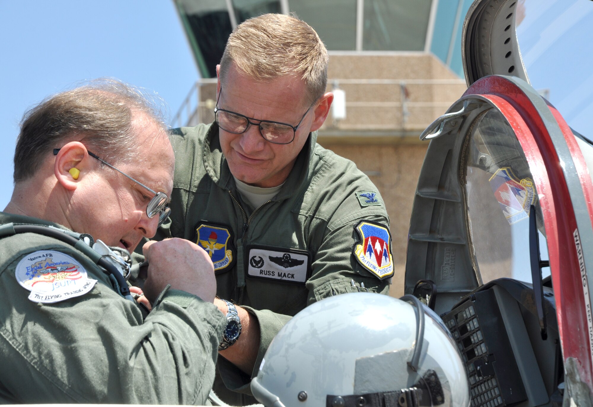 Ray Feightner Jr., left, the 2012 Honorary Commander of the 71st Flying Training Wing, at Vance AFB, Okla., gets pre-flight help from Col. Russ Mack, the former commander of the 71st FTW, before Feightner’s orientation ride in the T-38 Talon, Friday, June 8. The flight was also Mack’s fini-flight as the Wing commander. (U.S. Air Force photo/ 2nd Lt. Thomas Barger)