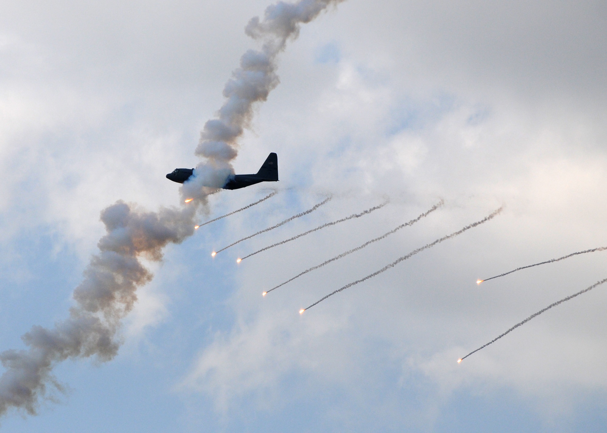 A C-130H tactical aircraft assigned to the Texas Air National Guard's 136th Airlift Wing at Naval Air Station Fort Worth, Joint Reserve Base, trains to evade ground attack during a low-altitute combat support training mission at Yankee Range, the northern of two ranges that comprise the McMullen Target Complex, which is part of Naval Air Station Kingsville, and is managed by Detachment 1, a subcomponent of the Texas Air National Guard's 149th Fighter Wing at Lackland Air Force Base, Texas, on May 30, 2012. (Air National Guard photo by Senior Master Sgt. Mike Arellano / Released)