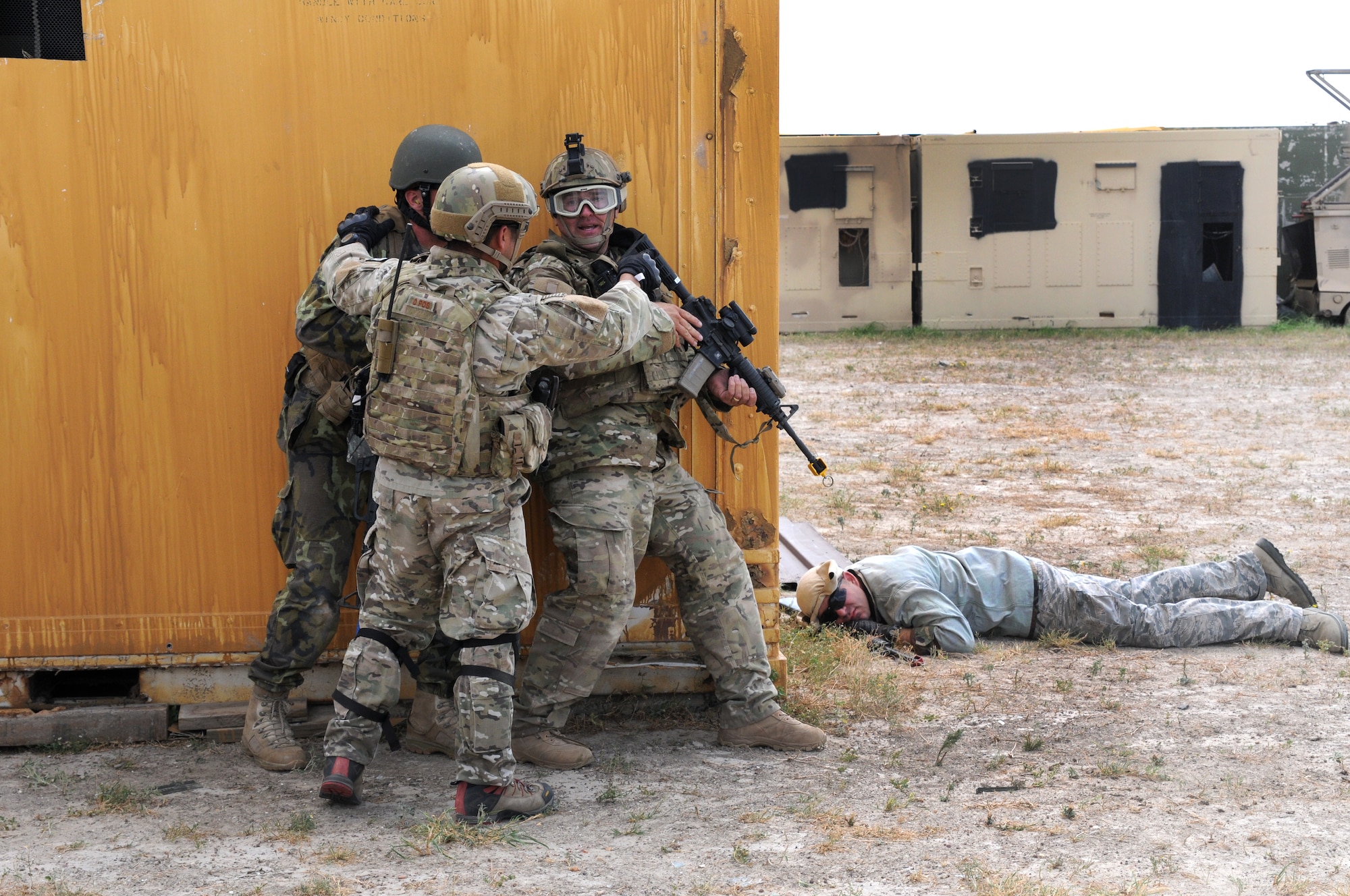 Members of the Texas Air National Guard's 147th Air Support Operations Squadron participate in training operations at a military operations in urban terrain (MOUT) site at Yankee Range, the northern of two ranges that comprise the McMullen Target Complex, which is part of Naval Air Station Kingsville, and is managed by Detachment 1, a subcomponent of the Texas Air National Guard's 149th Fighter Wing at Lackland Air Force Base, Texas, on May 30, 2012. (Air National Guard photo by Staff Sgt. Phil Fountain / Released)