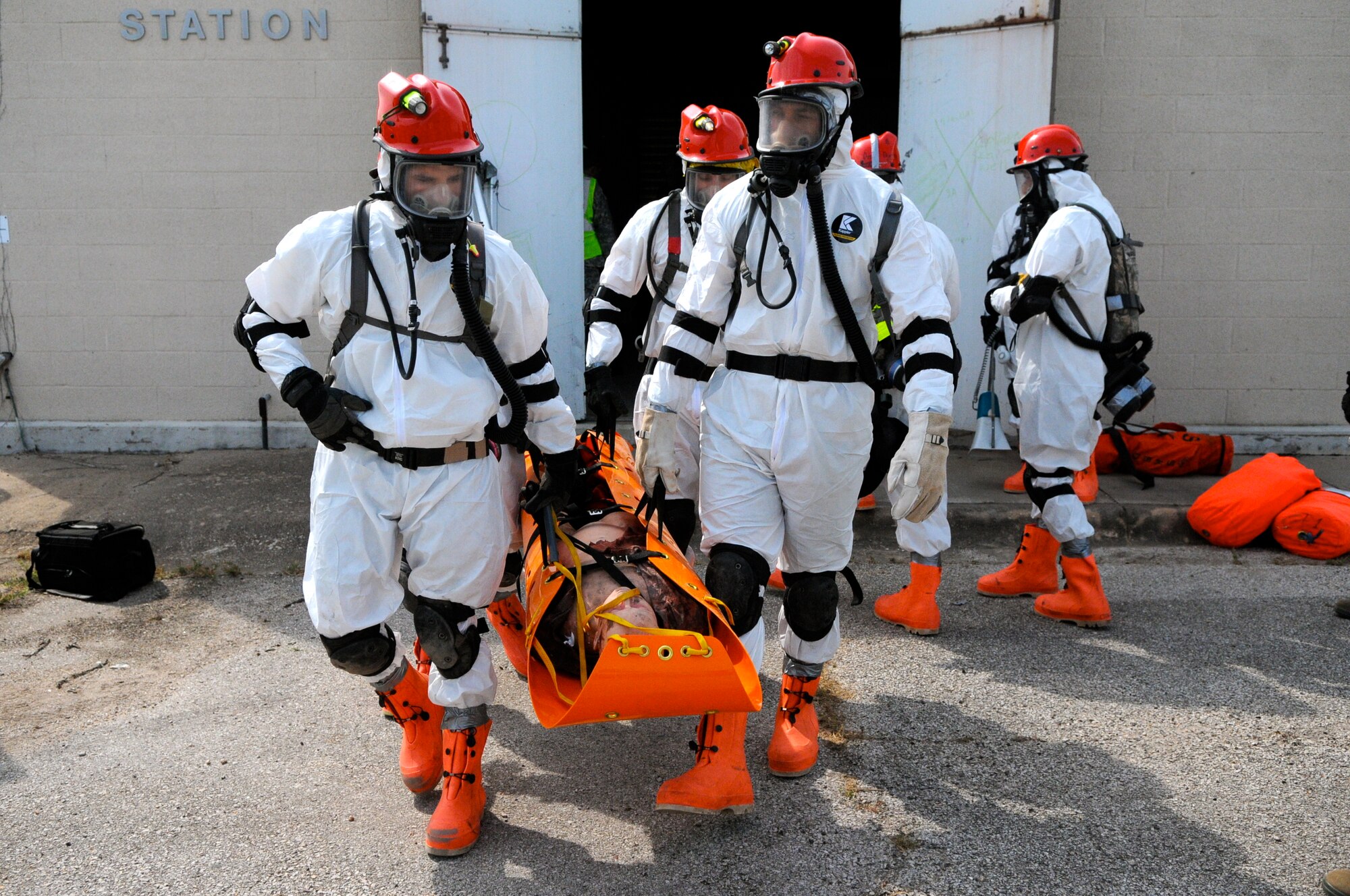 Members of the 6 CBRNE Emergency Response Force Package (CERF-P), a subcomponent of Joint Task Force-71, simulate removing victims of a chemical attack during an emergency preparedness exercise in Austin, Texas, on Apr. 26, 2012. (Air National Guard photo by Senior Master Sgt. Mike Arellano / Released)