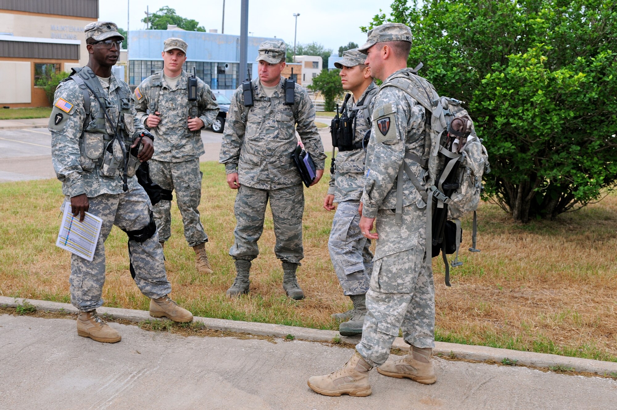 Army Lt. Col. Les Edwards (left), commander of the 6 CBRNE Emergency Response Force Package (CERF-P), a subcomponent of Joint Task Force-71, confers with members of the joint medical operations team during an emergency preparedness exercise in Austin, Texas, on Apr. 26, 2012. (Air National Guard photo by Senior Master Sgt. Mike Arellano / Released)