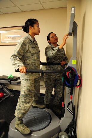 Major Lee Warlick, a physical therapist with the 628th Medical Group, shows Cadet 2nd Class Raika Dacquel, a student with the Air Force Academy, the Biodex Balance Trainer which is used to improve balance and sense of ones lower extremities at the Physical Therapy center on Joint Base Charleston, S.C. June 8, 2012. Cadets visited JB Charleston to get a first-hand look at various career opportunities. (U.S. Air Force photo/Staff Sgt. Katie Gieratz)