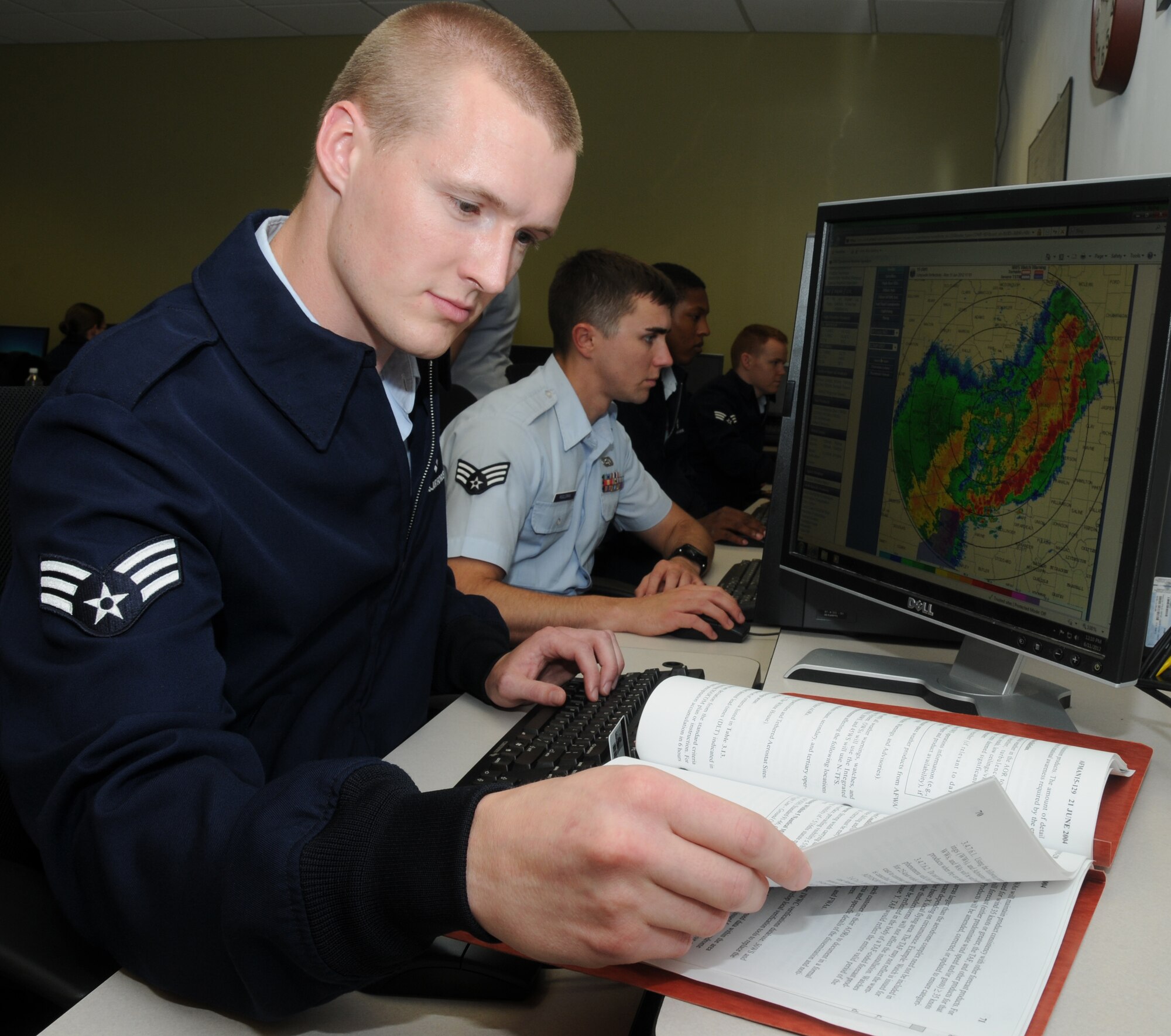 Air Force District of Washington weather forecaster Senior Airmen Matthew Butler reviews weather forecasts during training at Keesler Air Force Base, Miss. Butler was selected as one of 12 of the Air Force 2012 Outstanding Airmen of the Year.  He is currently stationed at Scott Air Force Base, Ill., with the 15th Operational Weather Squadron, an element under AFDW.  (U.S. Air Force photo by Kemberly D. Groue) 