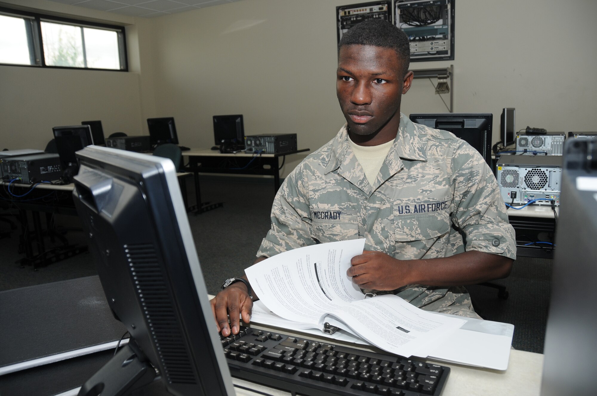 Airman Basic Kendrick A. McCrady graduated with a perfect score from cyber systems operation apprentice course in the 336th Training Squadron June 6, 2012, at Thomson Hall, Keesler Air Force Base, Miss. McCrady, a native of Port Orchard, Wash., will remain at Keesler to train in the cyber security plus course.  (U.S. Air Force photo by Kemberly Groue)