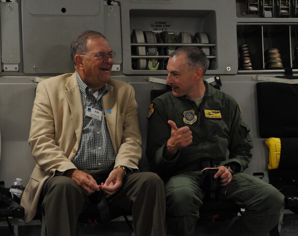 Chief Master Sgt. Larry Williams, 437th Airlift Wing command chief out of Joint Base Charleston, S.C., speaks with Team Charleston honorary commander Bill Collins, Mayor of the town of Summerville, aboard a C-17 Globemaster III during an orientation flight June 12, 2012. The honorary commanders program is used as a tool to educate local community leaders about the various missions at JB Charleston. The tours will take place on a quarterly basis, and as part of that education process, the 437th AW set aside a full day to give the civics an in-depth look at the wing's flying mission. It afforded them the opportunity to meet the Airmen, both maintainers and operators, who support the mission. (U.S. Air Force photo/Airman 1st Class Ashlee Galloway)