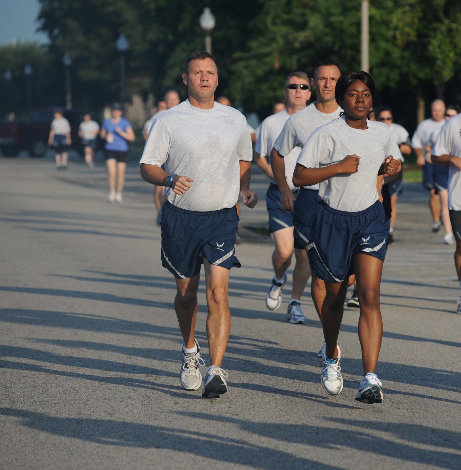 Chief Master Sgt. Oscar Mackin, 2nd Air Force command chief, and Airman 1st Class Shade Bennett, 81st Logistics Readiness Squadron, participate in the 5K professional wellness month run June 6, 2012, which began and ended at the Triangle Fitness Center at Keesler Air Force Base, Miss.  There were 64 individuals that participated in the race.  (U.S. Air Force photo by Kemberly Groue)