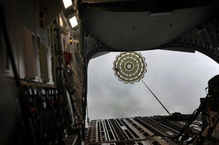 During a C-17 Globemaster III orientation flight for the Team Charleston honorary commanders, out of Joint Base Charleston, S.C., airmen demonstrate a low-level air drop, to show the capabilities that JB Charleston has to offer June 12, 2012. The honorary commanders program is used as a tool to educate local community leaders about the various missions at JB Charleston. The tours will take place on a quarterly basis, and as part of that education process, the 437th AW set aside a full day to give the civics an in-depth look at the wing's flying mission. It afforded them the opportunity to meet the Airmen, both maintainers and operators, who support the mission. (U.S. Air Force photo/Airman 1st Class Ashlee Galloway)