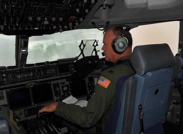 Colonel Erik Hansen, 437th Airlift Wing commander out of Joint Base Charleston, fly’s a C-17 Globemaster III during an orientation flight for the Team Charleston honorary commanders June 12, 2012. The honorary commanders program is used as a tool to educate local community leaders about the various missions at JB Charleston. The tours will take place on a quarterly basis, and as part of that education process, the 437th AW set aside a full day to give the civics an in-depth look at the wing's flying mission. It afforded them the opportunity to meet the Airmen, both maintainers and operators, who support the mission. (U.S. Air Force photo/Airman 1st Class Ashlee Galloway)