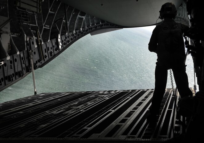 Staff Sgt. Danny South, 15th Airlift Squadron loadmaster out of Joint Base Charleston, S.C., lowers the cargo door of the C-17 Globemaster III, to demonstrate the capabilities of our JB Charleston aircraft to the Team Charleston honorary commanders June 12, 2012. The honorary commanders program is used as a tool to educate local community leaders about the various missions at JB Charleston. The tours will take place on a quarterly basis, and as part of that education process, the 437th AW set aside a full day to give the civics an in-depth look at the wing's flying mission. It afforded them the opportunity to meet the Airmen, both maintainers and operators, who support the mission. (U.S. Air Force photo/Airman 1st Class Ashlee Galloway)