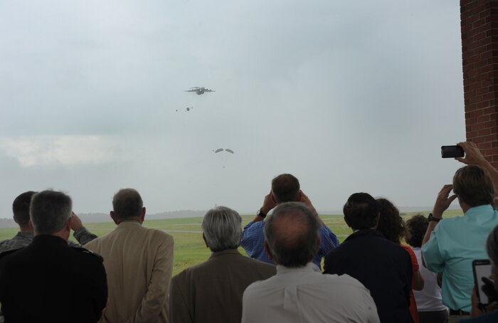 Team Charleston honorary commanders watch as airmen out of Joint Base Charleston, S.C. , demonstrate a low-level air drop, June 12, 2012, to show the capabilities that JB Charleston has to offer. The honorary commanders program is used as a tool to educate local community leaders about the various missions at JB Charleston. The tours will take place on a quarterly basis, and as part of that education process, the 437th AW set aside a full day to give the civics an in-depth look at the wing's flying mission. It afforded them the opportunity to meet the Airmen, both maintainers and operators, who support the mission. (U.S. Air Force photo/Airman 1st Class Ashlee Galloway)