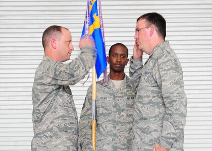 Colonel James Clavenna, 437th Maintenance Group commander, renders a salute to Maj. Matthew Manns, 437th Maintenance Operations Squadron incoming commander, during the 437th MOS change of command ceremony at Joint Base Charleston - Air Base, S.C, June 11, 2012. Maj. Manns took command of the 437th MXS. (U.S. Air Force photo/ Airman 1st Class Chacarra Walker)
