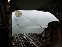 During a C-17 Globemaster III orientation flight for the Team Charleston honorary commanders, out of Joint Base Charleston, S.C., Airmen demonstrate a low-level air drop, to show the capabilities that the 437th Airlift Wing has to offer June 12, 2012. The Honorary Commanders program is used as a tool to educate local community leaders about the various missions at JB Charleston. The tours take place on a quarterly basis, and as part of that education process, the 437th AW set aside a full day to give the civics an in-depth look at the wing's flying mission. It afforded them the opportunity to meet the Airmen, both maintainers and operators, who support the mission. (U.S. Air Force photo/Airman 1st Class Ashlee Galloway)