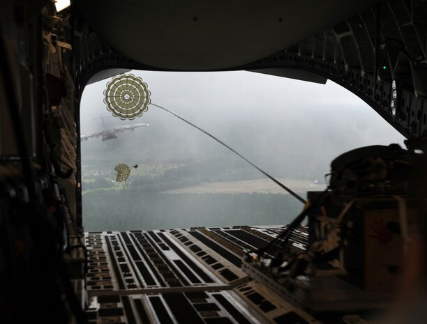 During a C-17 Globemaster III orientation flight for the Team Charleston honorary commanders, out of Joint Base Charleston, S.C., airmen demonstrate a low-level air drop, to show the capabilities that JB Charleston has to offer June 12, 2012. The honorary commanders program is used as a tool to educate local community leaders about the various missions at JB Charleston. The tours will take place on a quarterly basis, and as part of that education process, the 437th AW set aside a full day to give the civics an in-depth look at the wing's flying mission. It afforded them the opportunity to meet the Airmen, both maintainers and operators, who support the mission. (U.S. Air Force photo/Airman 1st Class Ashlee Galloway)
