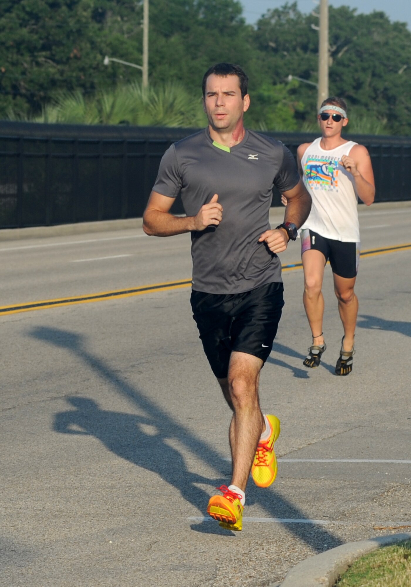Capt. Joshua Ord, 334th Training Squadron, finished first with a time of 20 minutes 19 seconds and 2nd Lt. David Lane, 81st Inpatient Operation Squadron, finished second with a time of 20 minutes 50 seconds in the 5K professional wellness month run June 6, 2012, which began and ended at the Triangle Fitness Center at Keesler Air Force Base, Miss.  (U.S. Air Force photo by Kemberly Groue)