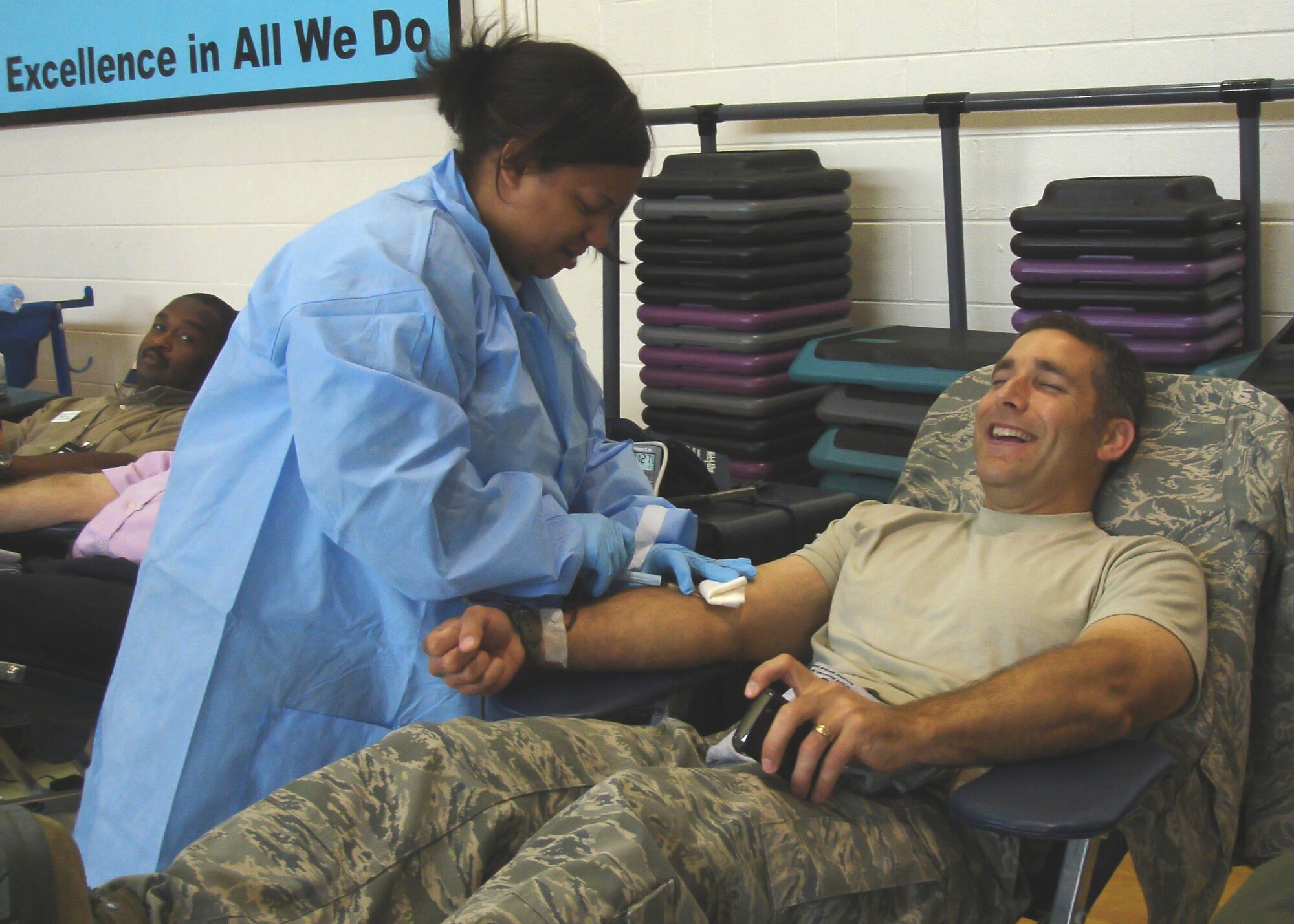 Amber Lee, Keesler Air Force Base Blood Donor Center, prepares a donor during a blood drive in Columbus Air Force Base, Miss., May 23, 2012.  (U.S. Air Force photo by Tech. Sgt. Debra Hafner)