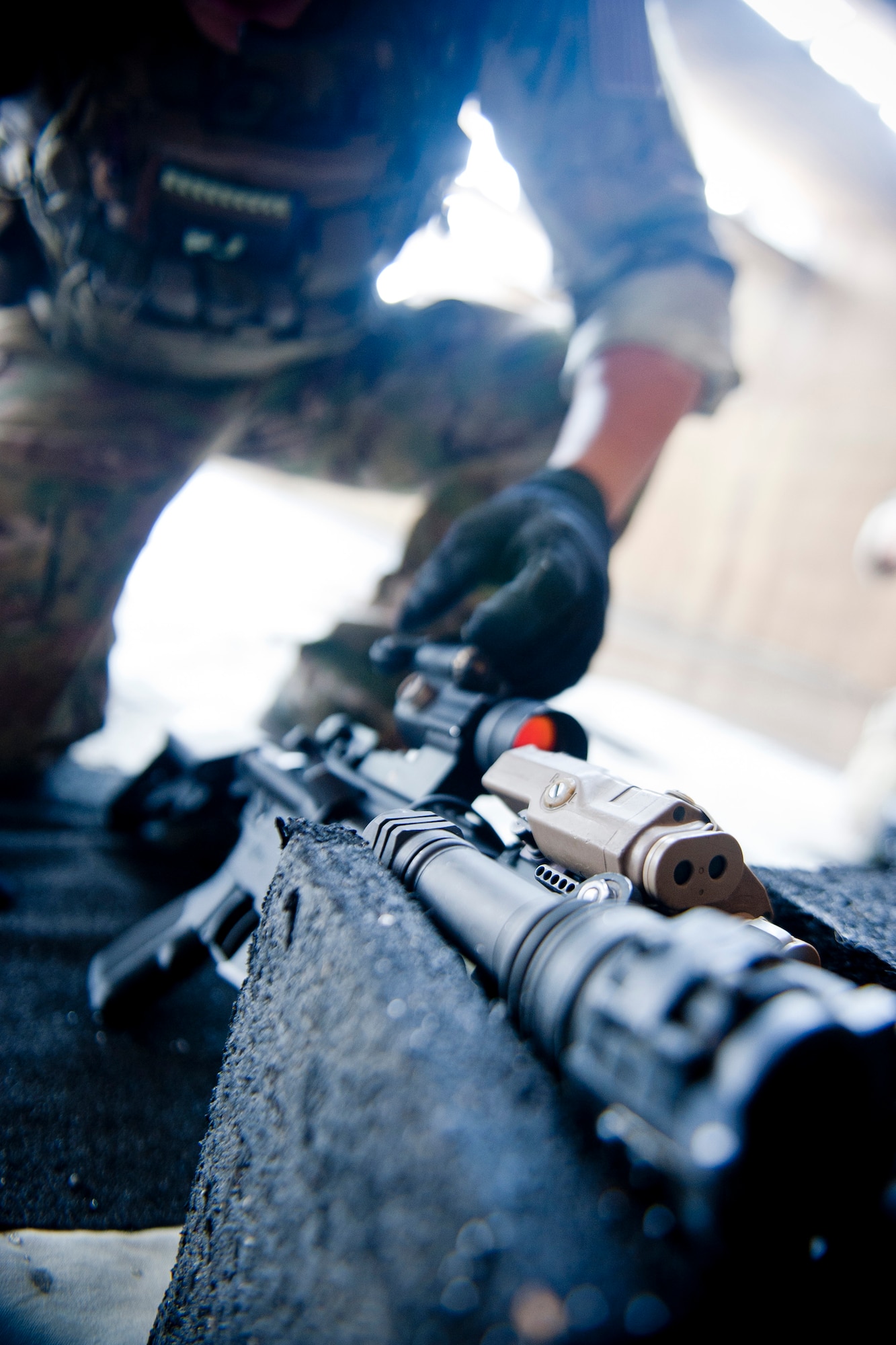 U.S. Air Force Staff Sgt. Eric Braddock, 38th Rescue Squadron pararescueman, makes sight adjustments to an M4 assault rifle during combat arms training June 12, 2012, at Moody Air Force Base, Ga. Making sight adjustments, also known as weapon zeroing, increases accuracy and builds a better understanding of how a weapon operates when fired, which can be beneficial to Airmen who deploy with the weapon they train on. (U.S. Air Force photo by Staff Sgt. Jamal D. Sutter/Released)  