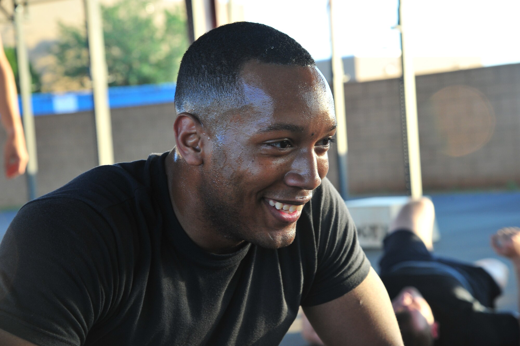 U.S. Airman 1st Class Stephen Washington, 27th Special Operations Aircraft Maintenance Squadron communication navigation apprentice, rests after completing the morning crossfit session at the combat fitness pad at Cannon Air Force Base, N.M., June 11, 2012. Crossfit establishes broad general fitness versus specialization in one particular area of the body. (U.S. Air Force photo by Airman 1st Class Xavier Lockley)