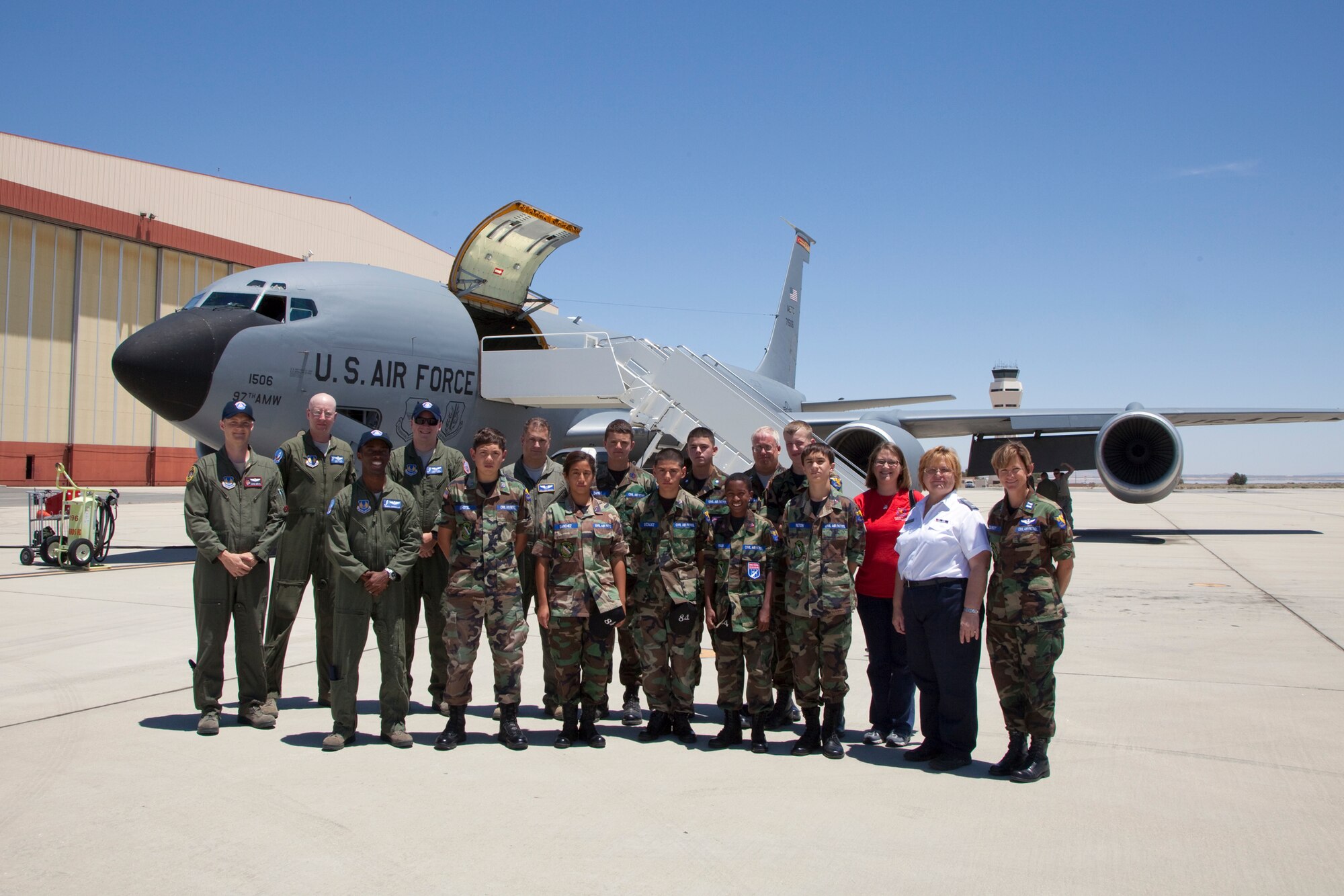 Members of Civil Air Patrol Squadron 84 pose in front of a KC-135 tanker June 7 before taking an incentive flight to watch a mid-air refueling of a B-2 stealth bomber.  The flight gave the cadets a firsthand show on real Air Force operations.  (U.S. Air Force photo by Bobbi Zapka)
