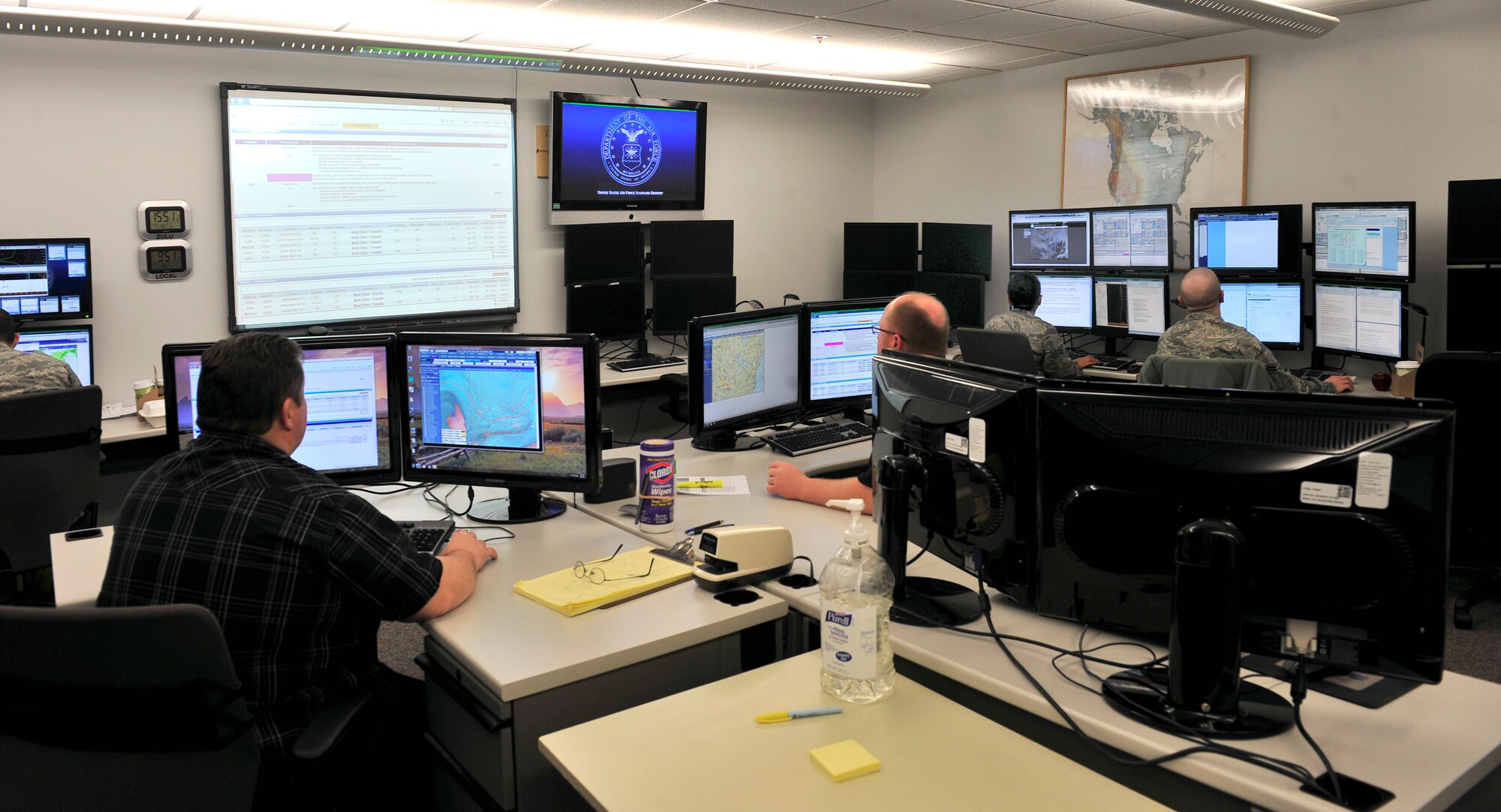 Employees monitor the weather at Scott Air Force Base’s 15th Operational Weather Squadron.  The organization will see an influx of new Airmen soon as overseas weather training locations close.(U.S. Air Force photo/ Staff Sgt. Stephenie Wade) 