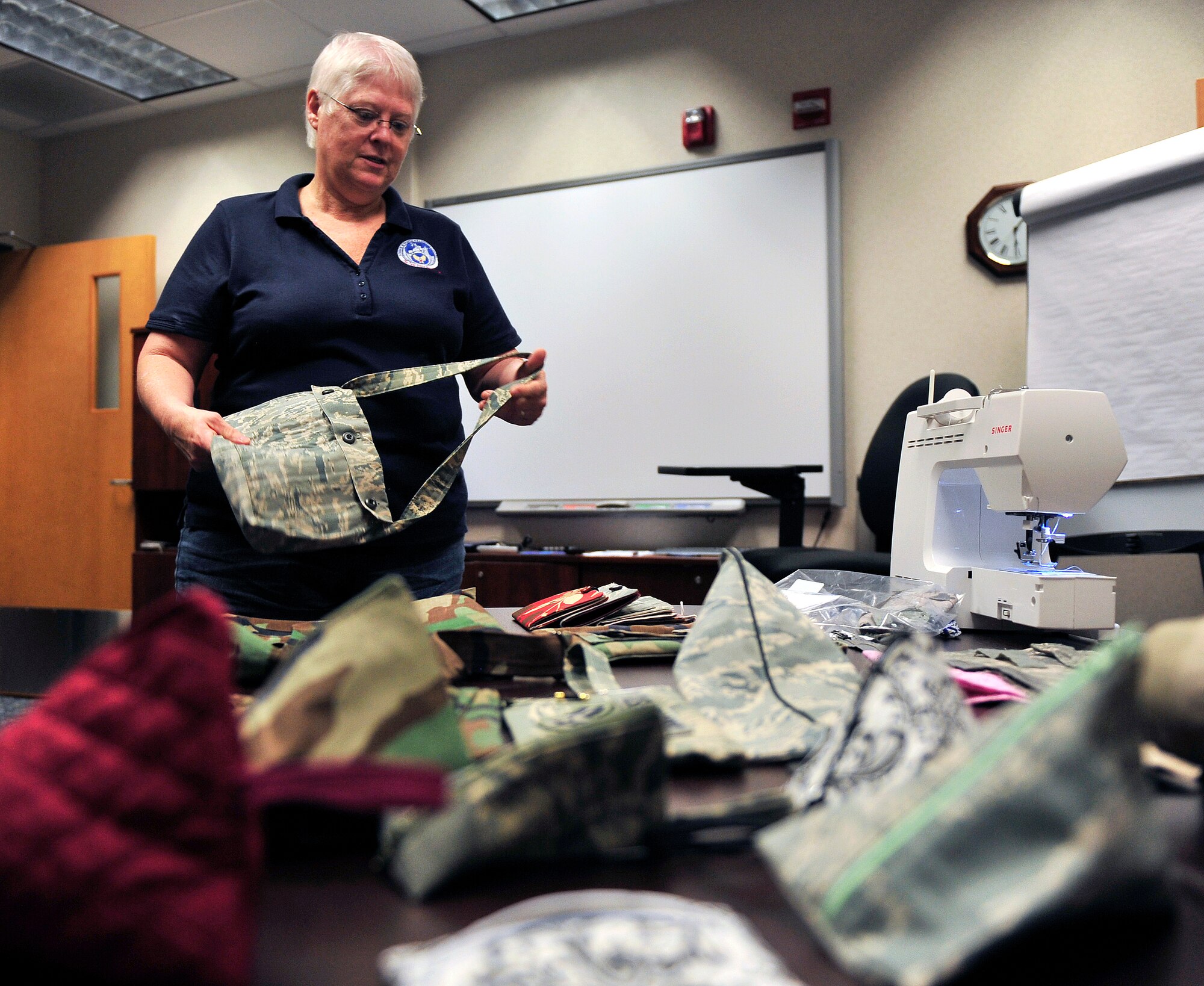 Peggy Beauvais makes purses out of unserviceable, donated uniforms and donates all the proceeds, $400 so far, to the Wounded Warriors program. Beauvais has worked for the military as a civilian employee for more than 28 years now. (U.S. Air Force photo/ Staff Sgt. Stephenie Wade) 