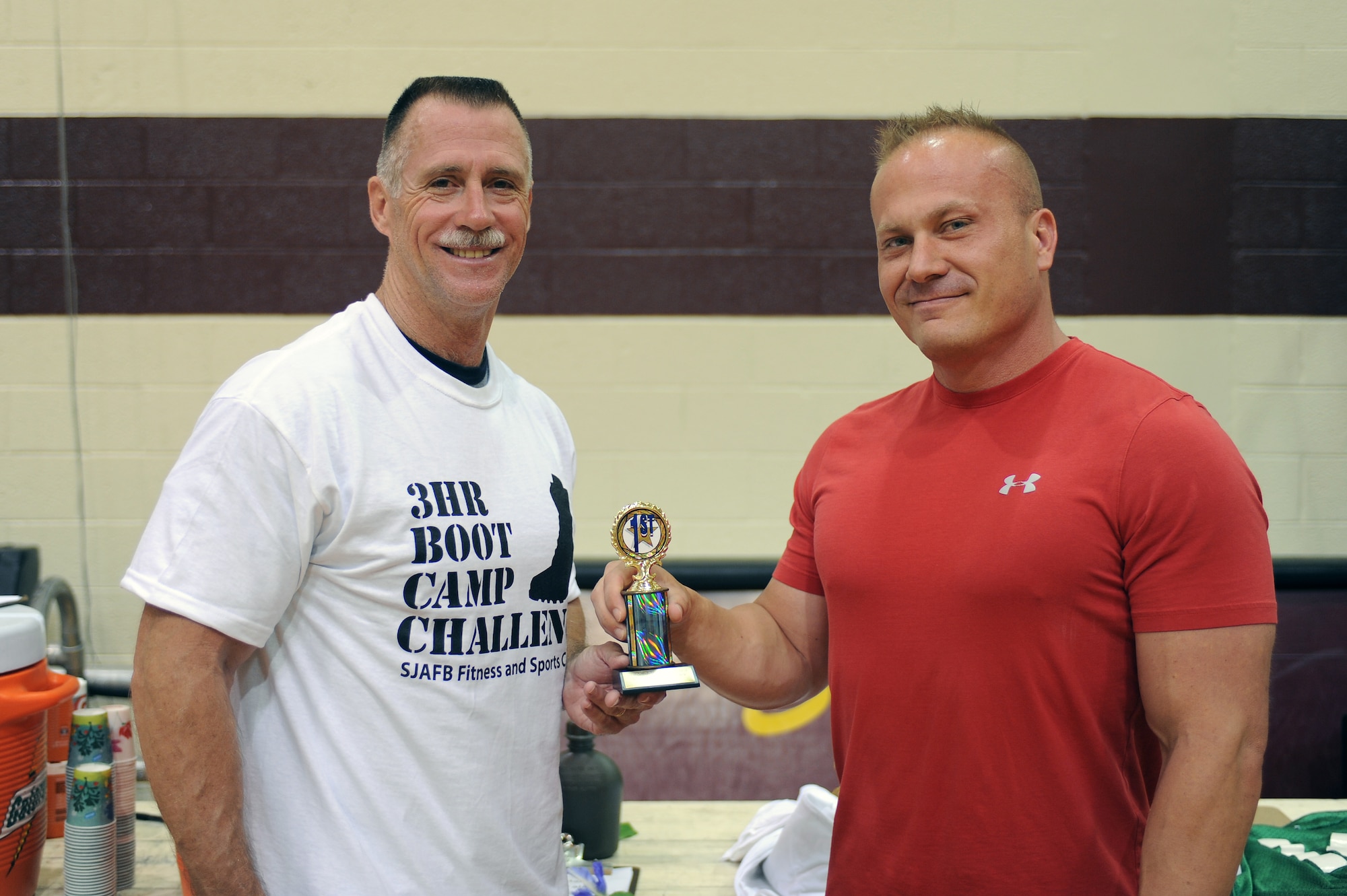 U.S. Air Force Senior Master Sgt. Timothy Moreland (left) and Mike Unden pose for a photo after a boot camp challenge on Seymour Johnson Air Force Base, N.C., June 9, 2012. Moreland competed for 2 hours and 47 minutes, outlasting 13 other competitors, to capture first place honors. Moreland, 916th Aerospace Medicine Squadron health services superintendent, is a native of Hollywood, Fla. Unden, 4th Force Support Squadron military fitness specialist, is from Wichita, Kan. (U.S. Air Force photo/Airman 1st Class John Nieves Camacho/Released)