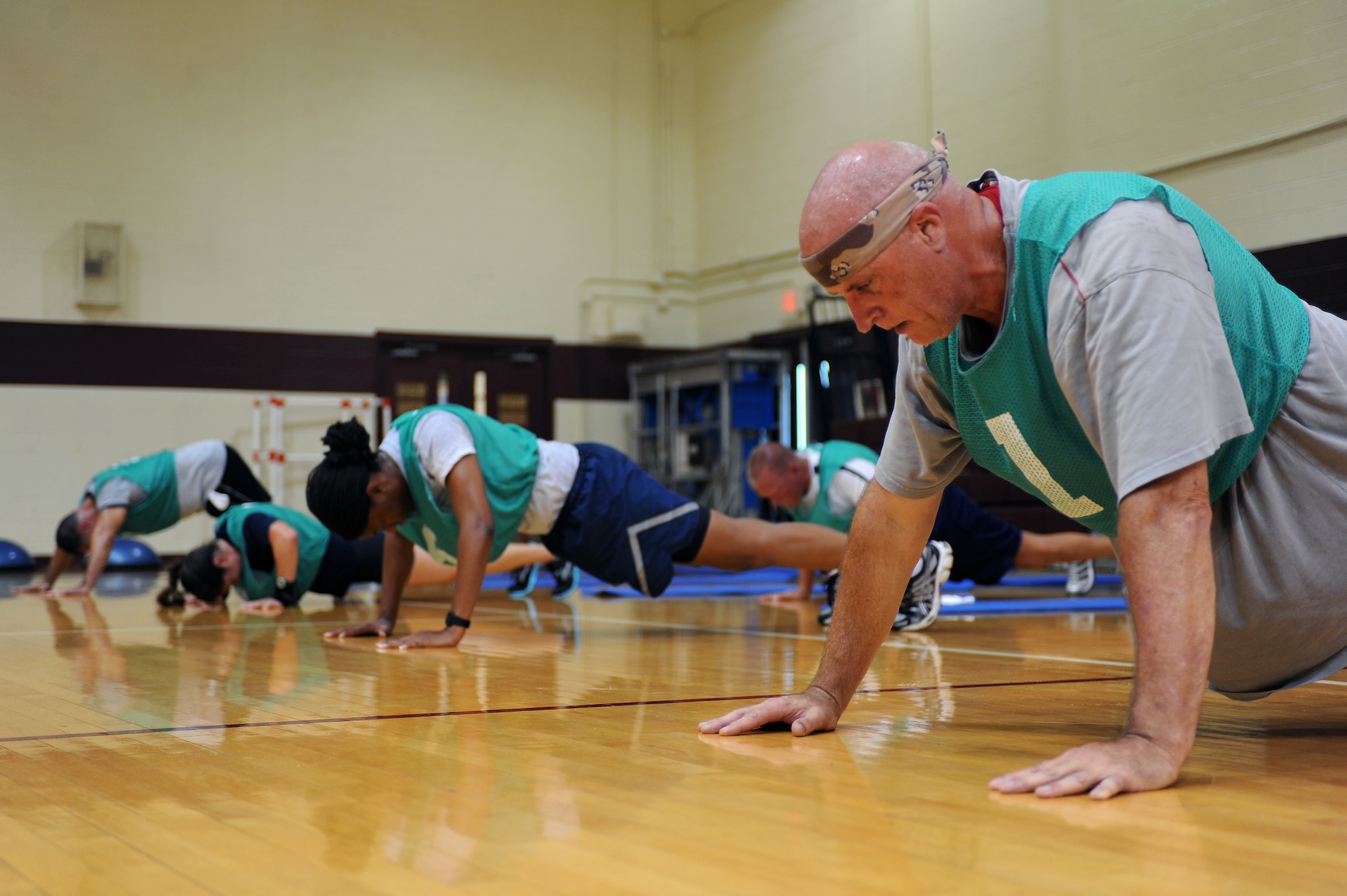U.S. Air Force Chief Master Sgt. Timothy Erdmann performs push-ups during a boot camp challenge on Seymour Johnson Air Force Base, N.C., June 9, 2012. The circuit training challenge involved upper and lower body, including abdominal exercises, each lasting one minute. Erdmann, 916th Maintenance Squadron superintendent, is from Menasha, Wis. (U.S. Air Force photo/Airman 1st Class John Nieves Camacho/Released)