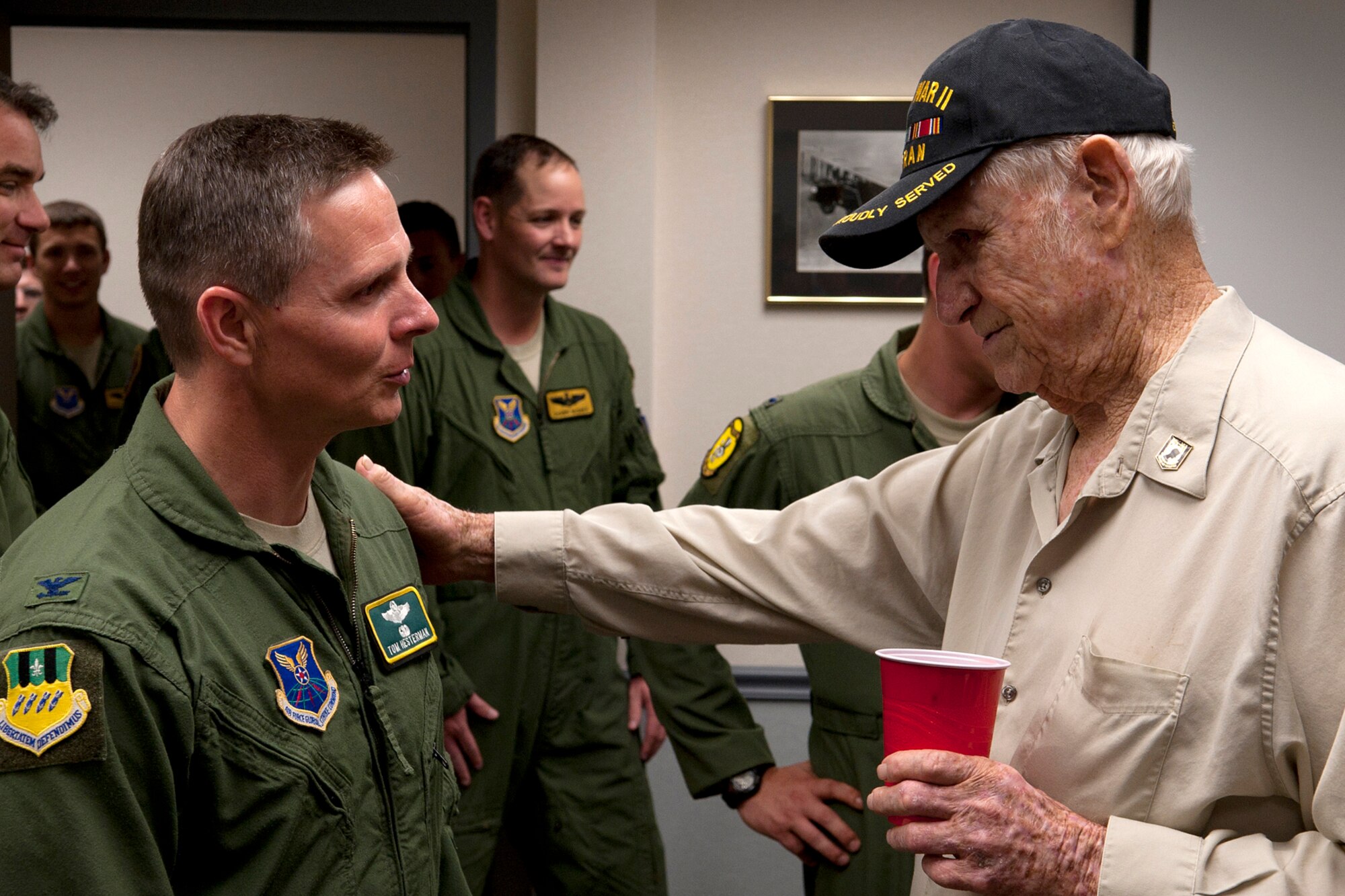 U.S. Air Force Col. Thomas Hesterman, the 2nd Bomb Wing vice commander, talks with Claude McCrocklin following a Room Dedication ceremony at Barksdale Air Force Base, La., June 1, 2012. McCrocklin was a 1st Lt. and bombardier during World War II. (U.S. Air Force photo by Master Sgt. Greg Steele/Released)