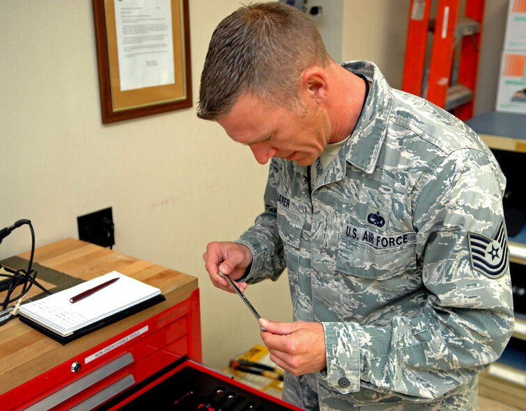 Tech. Sgt. Jeffrey Baker, 2nd Maintenance Group quality assurance inspector, inspects a tool box for compliance with the Maintenance Standards and Evaluation Plan, and Air Force Instructions at the 2nd Maintenance Squadron Accessories Flight Electrical and Environmental shop at Barksdale Air Force Base, La., June 11. Baker conducts monthly inspections at 64 different sections that can cover TOs, tools, housekeeping and personnel evaluations. (U.S. Air Force photo/Staff Sgt. Jason McCasland)(RELEASED)