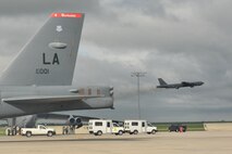 MINOT AIR FORCE BASE, N.D. -- A B-52H Stratofortress takes flight while a second Buff begins to taxi toward take off during a rapid launch that concluded an exercise here June 11. The rapid launch was a successful conclusion to the exercise which tested Airmen’s combat readiness and ability to deploy at a short notice at the request of combatant commanders. (U.S Air Force photo/Airman 1st Class Andrew Crawford)