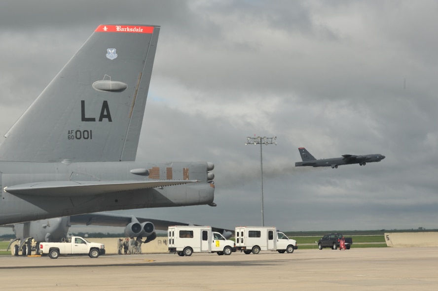 MINOT AIR FORCE BASE, N.D. -- A B-52H Stratofortress takes flight while a second Buff begins to taxi toward take off during a rapid launch that concluded an exercise here June 11. The rapid launch was a successful conclusion to the exercise which tested Airmen’s combat readiness and ability to deploy at a short notice at the request of combatant commanders. (U.S Air Force photo/Airman 1st Class Andrew Crawford)