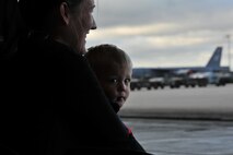 MINOT AIR FORCE BASE, N.D. -- Jessica Presley and her son Bryant sit and anticipate the launch of 17 B-52H Stratofortresses at the conclusion of an exercise here June 11. Jessica is the wife of Staff Sgt. Chad Presley who is a B-52 crew chief. (U.S Air Force photo/Airman 1st Class Andrew Crawford)