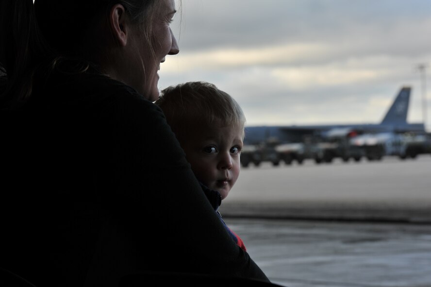 MINOT AIR FORCE BASE, N.D. -- Jessica Presley and her son Bryant sit and anticipate the launch of 17 B-52H Stratofortresses at the conclusion of an exercise here June 11. Jessica is the wife of Staff Sgt. Chad Presley who is a B-52 crew chief. (U.S Air Force photo/Airman 1st Class Andrew Crawford)