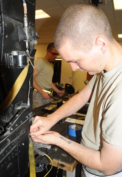 U.S. Air Force Airman 1st Class Jacob Anderson inspects an ejection seat on Seymour Johnson Air Force Base, N.C., June 12, 2012. Proper inspection of an F-15E Strike Eagle ejection seat is essential to aircrew safety. Anderson, 4th Component Maintenance Squadron egress apprentice, hails from Reno, Nev. (U.S. Air Force photo/Senior Airman Gino Reyes/Released)