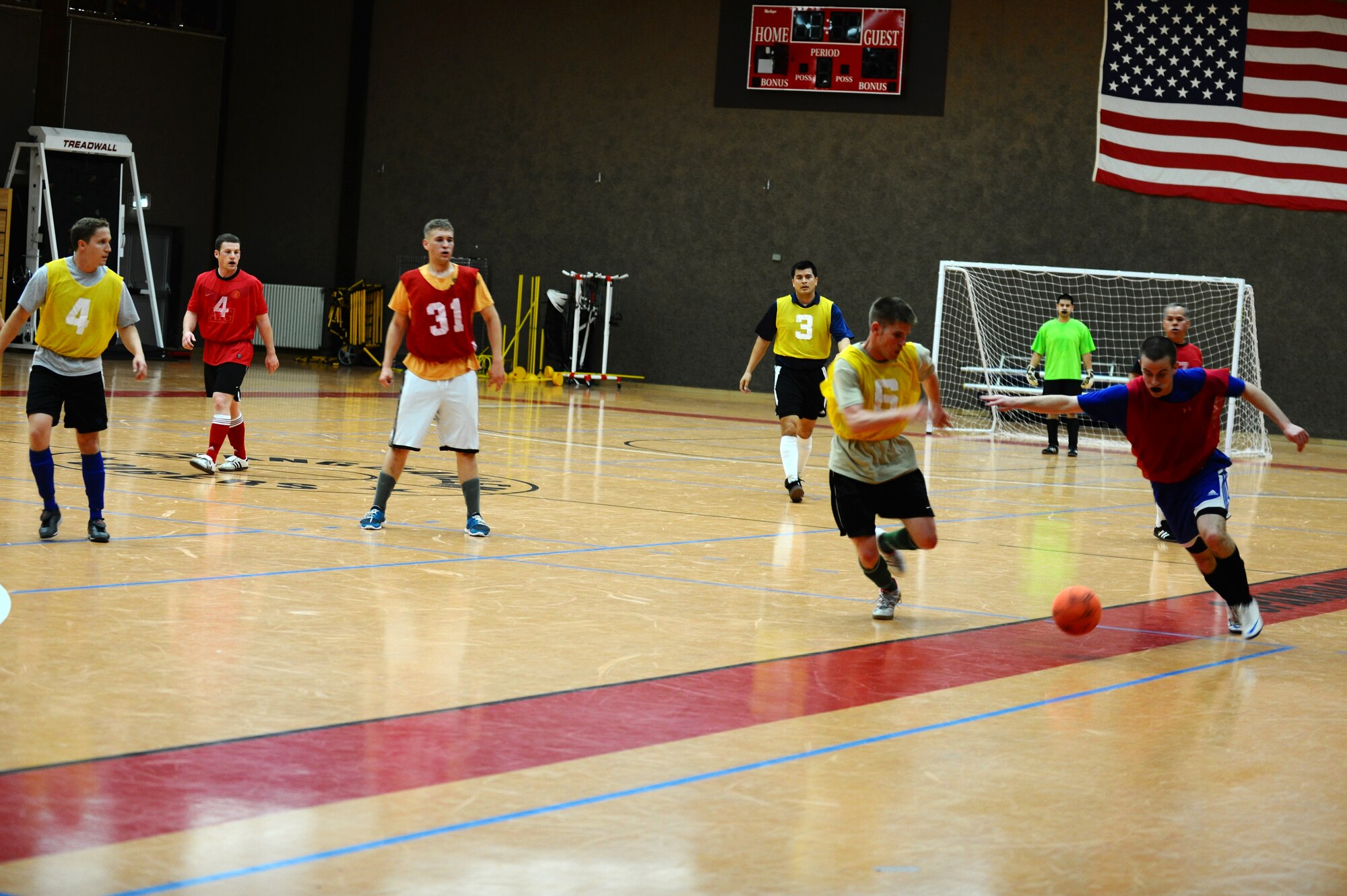SPANGDAHLEM AIR BASE, Germany – Carl Miller, right, 52nd Force Support Squadron, tries to get past defender Mike Krestyn, 81st Fighter Squadron, during the indoor soccer championship at the Skelton Memorial Fitness Center here June 12. The 52nd FSS defeated the 81st FS in the first game 7-6. The 81st FS won the double-elimination championship after winning the second game 9-5. (U.S. Air Force photo by Airman 1st Class Matthew B. Fredericks/Released)