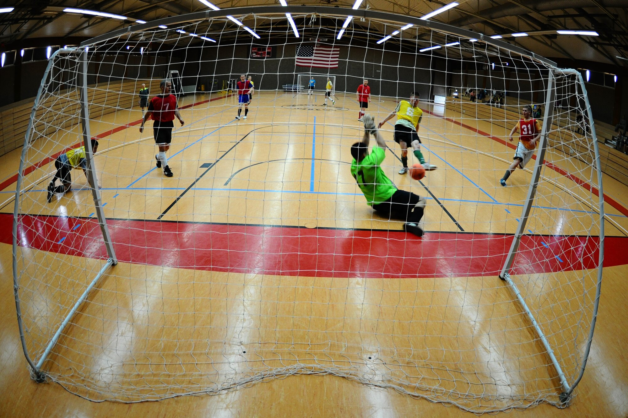 SPANGDAHLEM AIR BASE, Germany – Daniel Gonzales, 52nd Force Support Squadron, attempts to block a shot by Mike Krestyn, 81st Fighter Squadron, during the indoor soccer championship at the Skelton Memorial Fitness Center here June 12. The 52nd FSS defeated the 81st FS in the first game 7-6. The 81st FS won the double-elimination championship after winning the second game 9-5. (U.S. Air Force photo by Airman 1st Class Matthew B. Fredericks/Released)