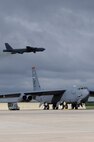 MINOT AIR FORCE BASE, N.D. -- A B-52H Stratofortress takes flight while a second Buff begins to power up its engines during a rapid launch that concluded the end of an exercise here June 11.The rapid launch was a successful conclusion to the exercise which tested Airmen's combat readiness and ability to deploy at a short notice at the request of combatant commanders. (U.S Air Force photo/Airman 1st Class Stephanie Ashley)