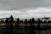 MINOT AIR FORCE BASE, N.D. -- Family and friends of B-52H Stratofortress pilots and crew members gather at an aircraft hanger to witness the rapid launch of 17 B-52s at the conclusion of an exercise here June 11. The take-off happens in rapid succession in order to simulate responding to a request for air support by combatant commanders. (U.S Air Force photo/Airman 1st Class Stephanie Ashley)