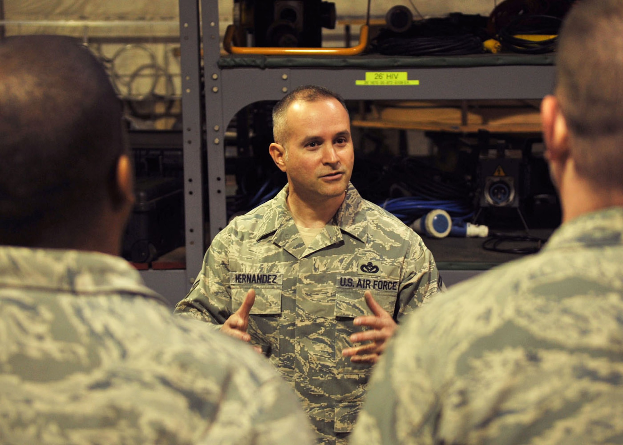RAF MILDENHALL, England -- Senior Master Sgt. Emilio Hernandez, 100th Civil Engineer Squadron Operations flight superintendent, provides mentorship to 100th CES Airmen. Hernandez was chosen as one of the U.S. Air Force's 12 Outstanding Airmen of the Year 2012. His achievements include earning the Bronze Star Medal, after deploying to Kandahar Airfield, Afghanistan, and serving as the 777th Expeditionary Prime Base Engineer Emergency Force Squadron operations flight chief in 2011. (U.S. Air Force photo/Senior Airman Ethan Morgan)