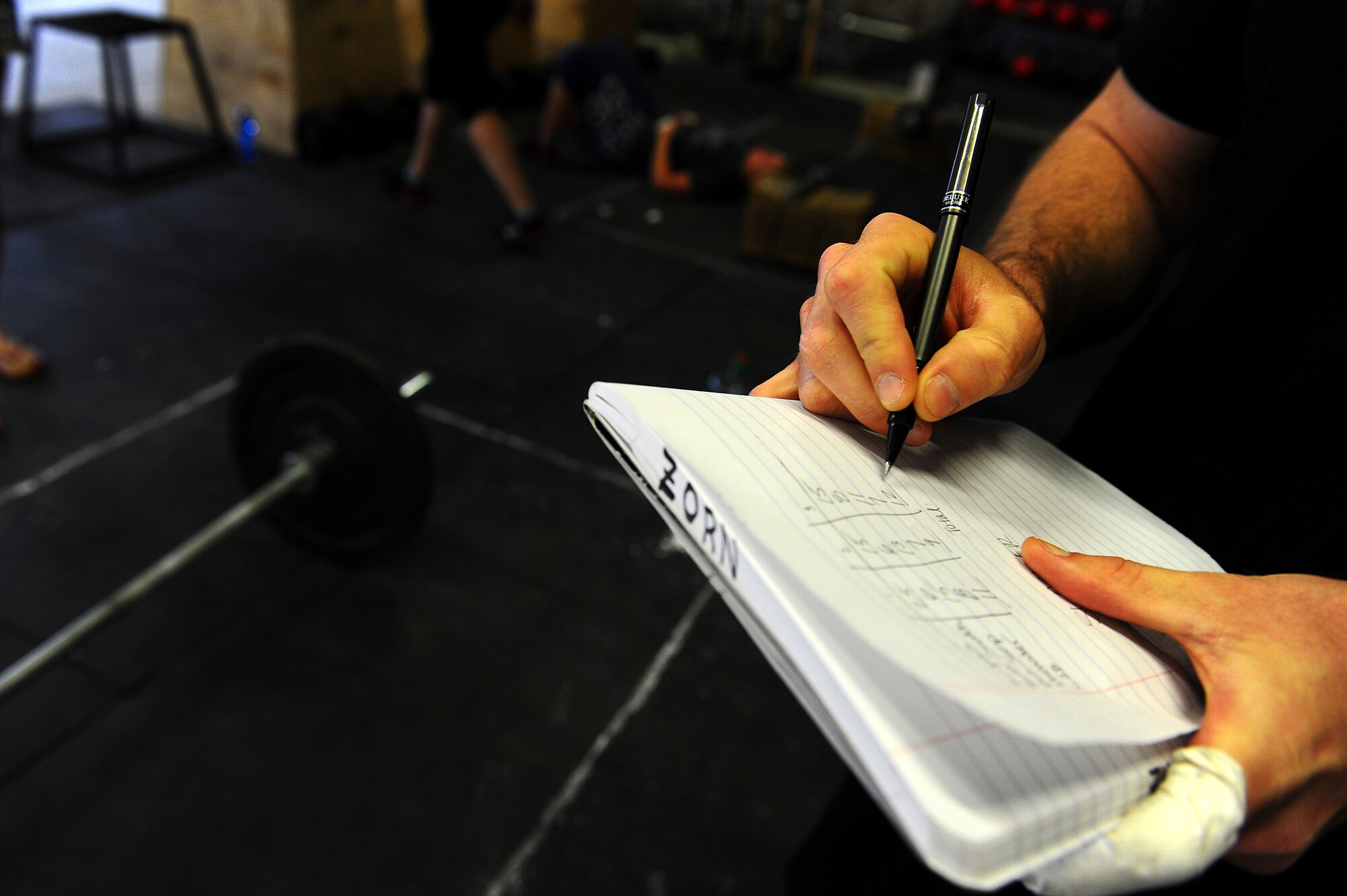 Maj. Jason Medsger, 435th Security Forces Squadron commander, annotates repetitions June 9 during a fundraiser for CrossFit for Hope. Seventeen members of CrossFit Rage Cage came together to participate in the fundraiser. CrossFit for Hope is a national fundraiser, which brings together the efforts of more than 900 CrossFit affiliated gyms to raise money in support of St. Jude Children's Research Hospital. Members of CrossFit Rage Cage raised $1,200 to help meet the national goal of $1.7 million. (U.S. Air Force photo/Airman Basic Brea Miller)