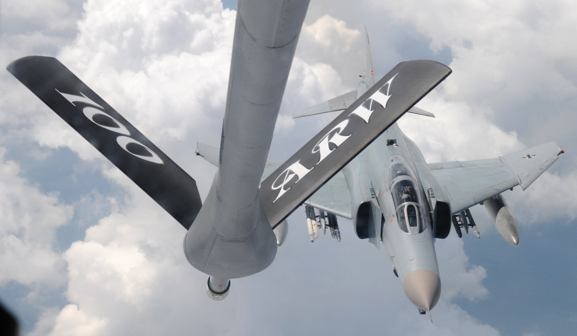 GERMANY – A German F-4 Phantom approaches an RAF Mildenhall KC-135 Stratotanker June 12, 2012 over German skies. The 100th Air Refueling Wing trains consistently with its NATO allies to ensure mission success between partner nations. (U.S. Air Force photo/Senior Airman Rachel Waller)