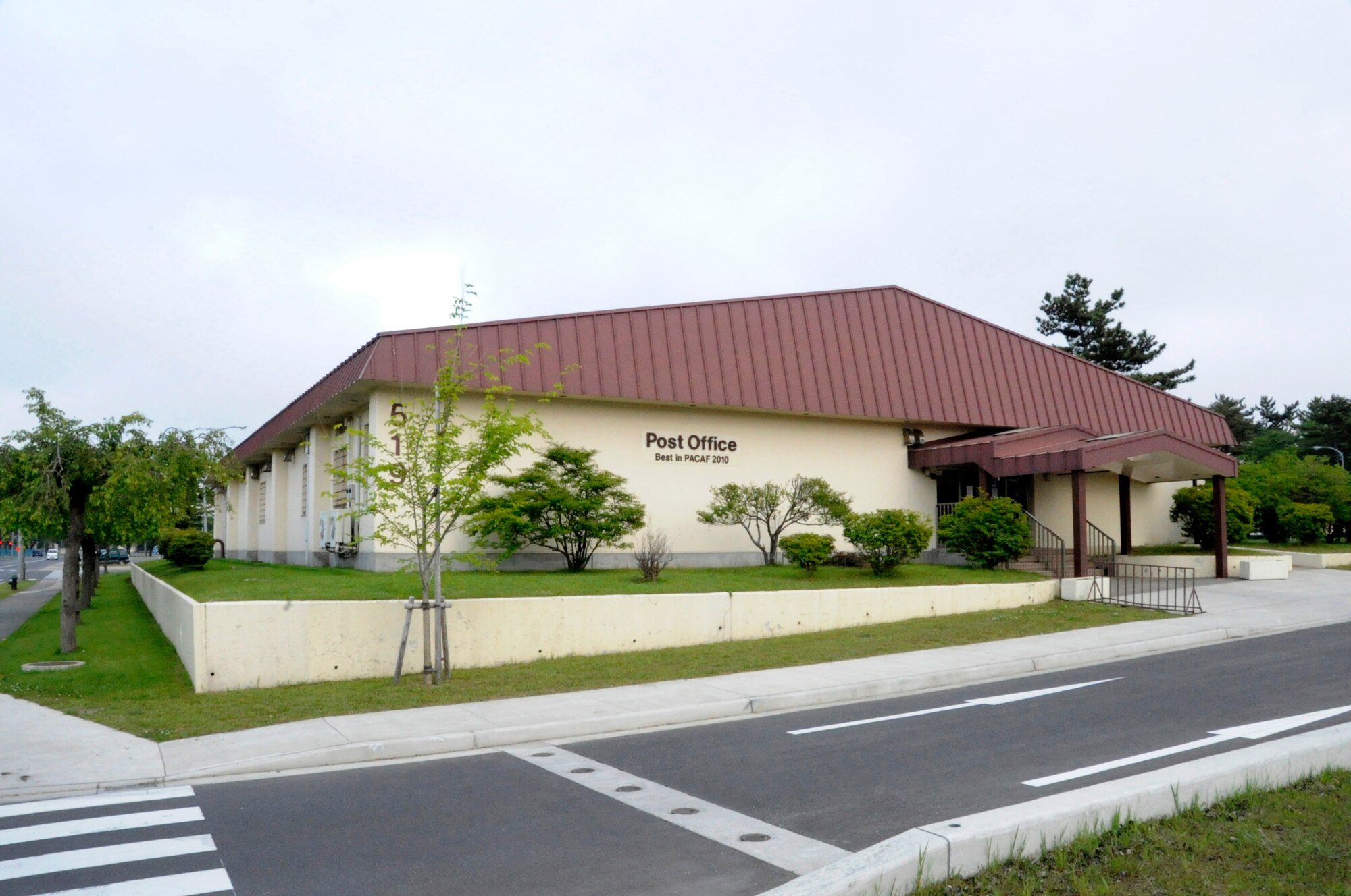 The base post office is located next to the main base shoppette at Misawa Air Base, Japan, June 7, 2012. The base post office is open 24 hours to get mail from private boxes; the parcel pick-up window's hours of operation are from 10 a.m. to 6 p.m. Monday through Friday and 10 a.m. to 4 p.m. on Saturday. For more information about the base post office call 226-3492. (U.S. Air Force photo by Airman 1st Class Kaleb Snay/Released)