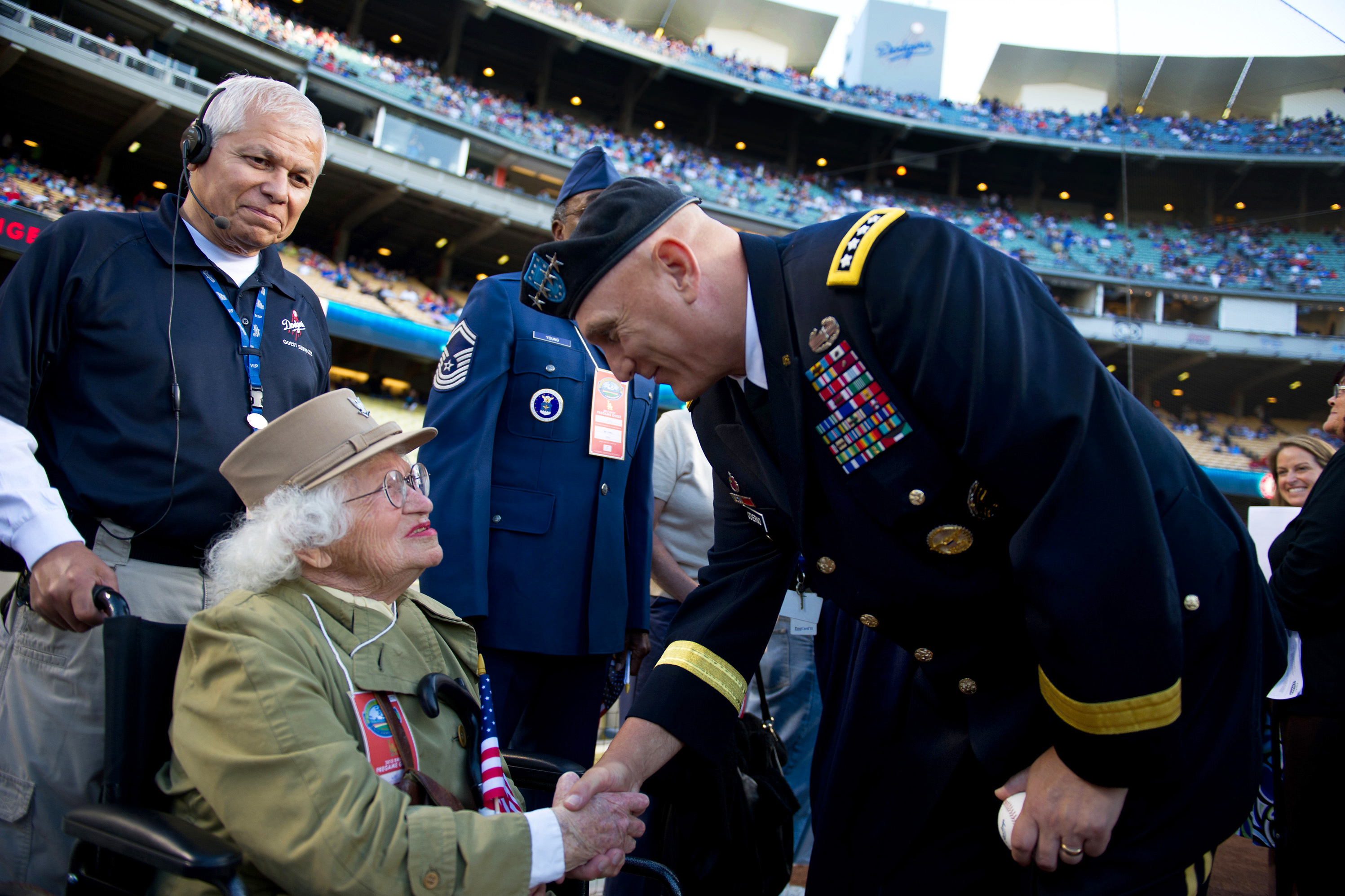 Army Chief of Staff Gen. Ray Odierno stands next to the umpire