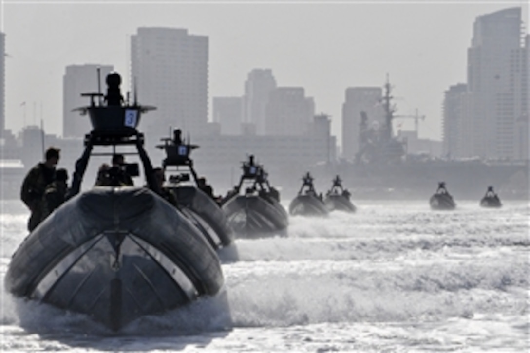 Rigid-hull inflatable boats carry guests and sailors assigned to Special Boat Team 12 through San Diego Bay to an at-sea change of command in San Diego, June 7, 2012. 